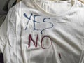 Writing Yes and No on T-Shirt with Ink Royalty Free Stock Photo