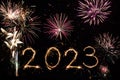 2023 Happy New Year eve text of Sparkle firework on black night sky. Fireworks and illumination celebration Royalty Free Stock Photo
