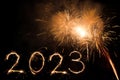 2023 happy new year firework banner. Sparks, fireworks and sparklers on black night sky as a holiday background Royalty Free Stock Photo