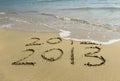 2012 and 2013 written in sand Royalty Free Stock Photo