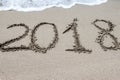 2018 written on the sand of a beach, closeup Royalty Free Stock Photo