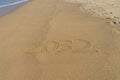 2032 written in the sand on the beach - Happy New Year