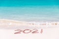 2021 written on the sand of a beach travel 2020 new year concept Royalty Free Stock Photo
