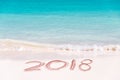 2018 written on the sand of a beach, travel 2018 new year Royalty Free Stock Photo