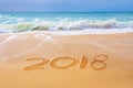 2018 written on the sand of a beach, travel new year concept Royalty Free Stock Photo