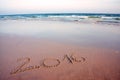 2016 written in sand on tropical beach, in sunset Royalty Free Stock Photo