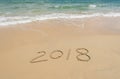 2018 written in sand write on beach Royalty Free Stock Photo