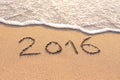 2016 written on a sandy beach for new year concept Royalty Free Stock Photo