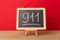 911 written on school blackboard Royalty Free Stock Photo