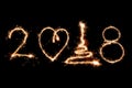 2018 written with Sparkle firework on black background, happy ne Royalty Free Stock Photo