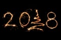 2018 written with Sparkle firework on black background, happy ne Royalty Free Stock Photo