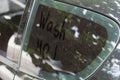 Written text WASH ME on dirty car window Royalty Free Stock Photo