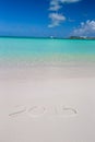 2016 written on tropical beach white sand with Royalty Free Stock Photo