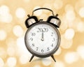 2020 written on a vintage alarm clock, bokeh lights background, happy new year eve party time and midnight countdown Royalty Free Stock Photo