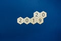 2019 written on wooden hexagons changing the last two digits to 2020 Royalty Free Stock Photo
