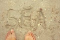 Written word sea on the beach sand Royalty Free Stock Photo