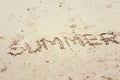 Written word summer on the beach sand Royalty Free Stock Photo