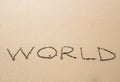 Written word world on sand of beach Royalty Free Stock Photo