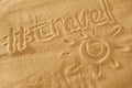 Written words travel with sun sign and beam on sand of beach wave background Royalty Free Stock Photo