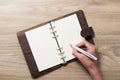 Writting on blank white notepad with right hand side Royalty Free Stock Photo