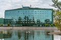 WrocÃâaw hotel Park Plaza on the Oder River with swans swimming