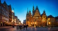 Wroclaw central market square with old houses, Town Hall and sunset, horse and carriage. Panoramic night view, long exposure.