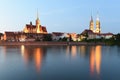 Wroclaw cityscape with Church of the Holy Cross and St. Bartholomew and Cathedral of St John the Baptist with river Odra at night