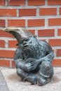 Wroclaw dwarf, small fairy-tale bronze figurine on the side walk, Wroclaw, Poland