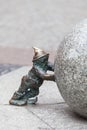 Wroclaw dwarf, small fairy-tale bronze figurine on the side walk, , Wroclaw, Poland
