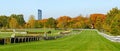 Wroclaw, horse racing track with obstacles, autumn landscape with colorful trees on a sunny day. The modern Sky Tower building