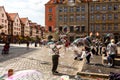 Man launches soap bubbles entertain tourists in the old city cen Royalty Free Stock Photo