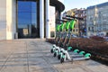 Parked electric scooters `lime`s` on sidewalk .