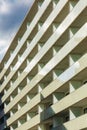 Perspective view to facade of modern building of new estate with glass balconies Royalty Free Stock Photo