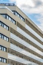 Perspective view to facade of modern building of new estate with glass balconies Royalty Free Stock Photo