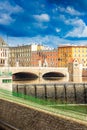 Renovated old Pomorski bridge at city center over Odra river with view to barrage with falling