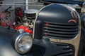 WROCLAW, POLAND - August 11, 2019: USA cars show: Dodge truck pickup 1941. Renovated black colour. Close up of engine and light