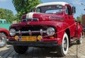 WROCLAW, POLAND - August 11, 2019:  USA cars show: 1951 Renovated Ford F-100 Pickup Truck of red and white colors.r Royalty Free Stock Photo