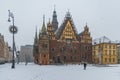 Facade of town hall at Market square full of white fresh snow at winter