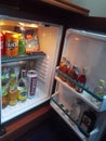 Wroclaw, Poland: Mini bar with soft drinks, vodka, wine, snacks and beer in the hotel room refrigerator. Room Royalty Free Stock Photo