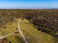 Aerial drone look to green park with long paths