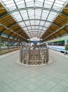 Symmetrical view to platform at main railway station with Intercity train