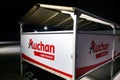 Wroclaw, Poland, February 15, 2024: White and Red Food Cart on Parking Lot. Auchan chain of stores.