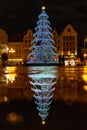 Wroclaw market square at night with some of walking people, glowing lanterns and beautifully and Royalty Free Stock Photo