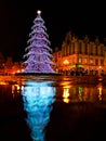 Wroclaw market square at night with some of walking people, glowing lanterns and beautifully and Royalty Free Stock Photo