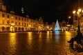 Wroclaw market square at night with some of walking people, glowing lanterns and beautifully and Royalty Free Stock Photo