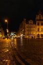 Wroclaw market square at night with some of walking people, glowing lanterns and beautifully and Royalty Free Stock Photo