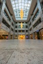 Interiors of beautifully renovated in modern and exclusive style old shopping mall full of marble