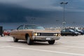 Meeting of fans of old cars at parking of shopping mall