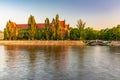 Beautiful and colorful facade of National Museum full of ivy next to promenade over the Odra river