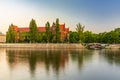 Beautiful and colorful facade of National Museum full of ivy next to promenade over the Odra river